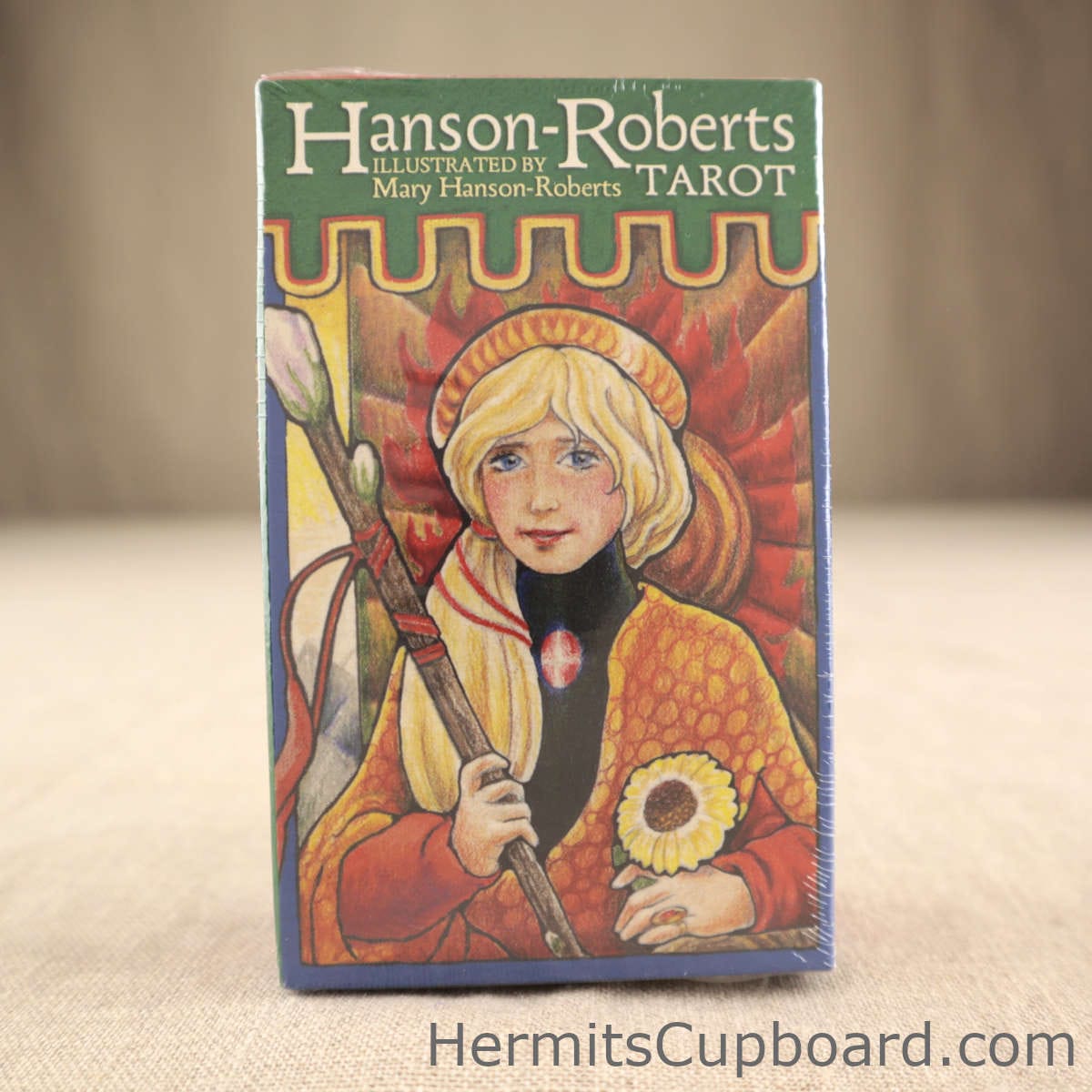 Hanson-Roberts Tarot front of box, colored penciled boy holding dpear and yellow sun flower