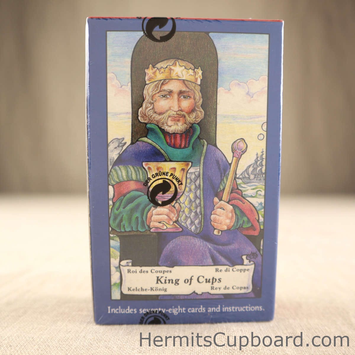 Hanson-Roberts Tarot back of box pencil colored king of cups holding a cup in the right hand a a cepter in his right.