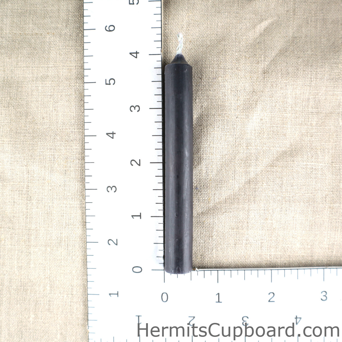 Black Chime Candle next to ruler for comparison