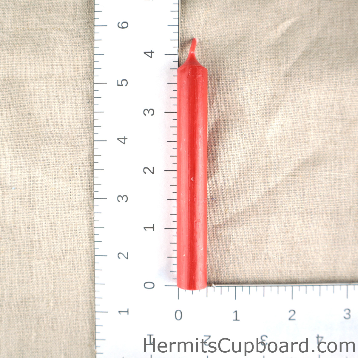 Red Chime Candle next to ruler for comparison