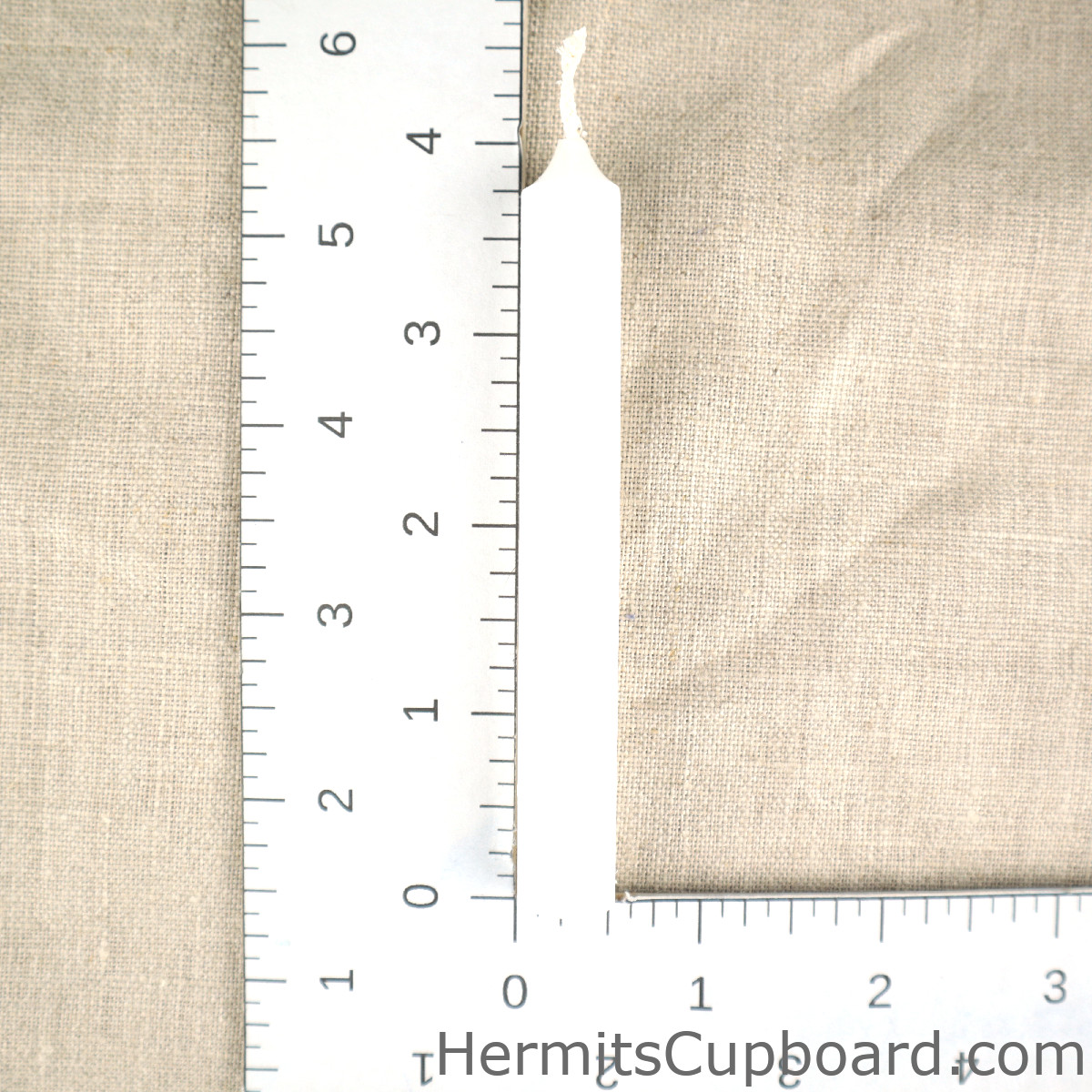 White Chime Candle next to ruler for comparison